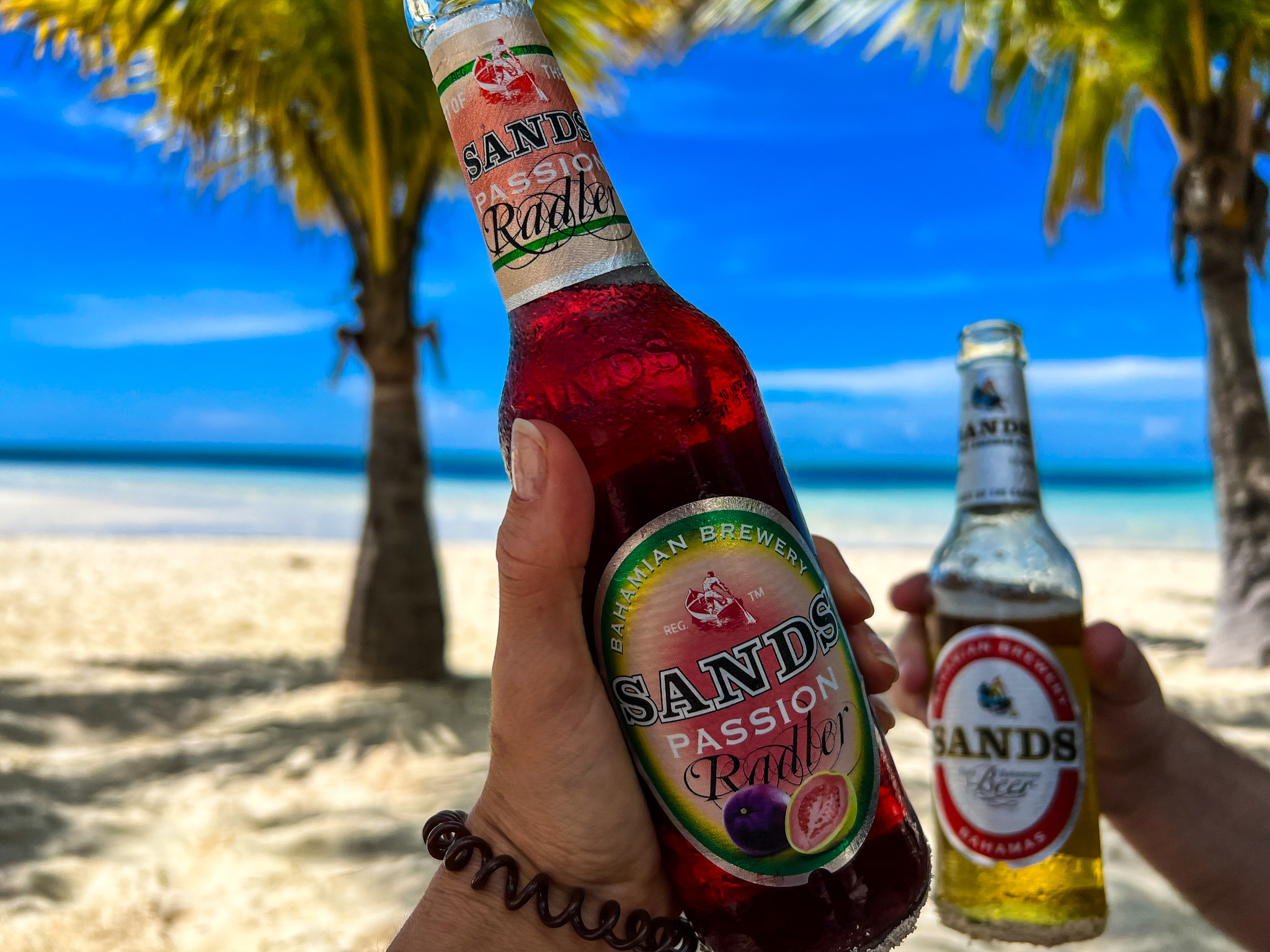Enjoy pristine white sand beaches, turquoise water, and a sands beer in Freeport, Grand Bahama.